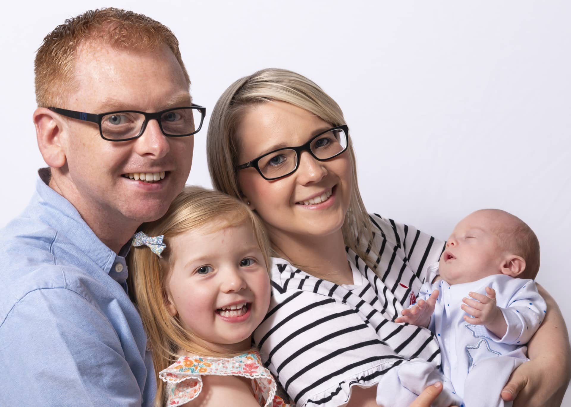 A man, woman, young girl and a baby